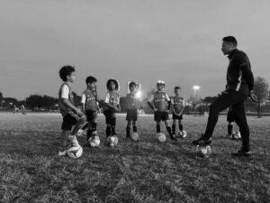 black and white boys soccer game hunter's creek soccer club